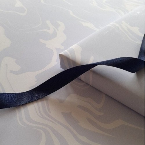Photo-quality personalised Christmas gift wrap is possible with our paper rolls